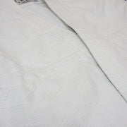 The hishi-zashi patterning on the lower half.