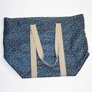 View of the tombo themed brocade bag empty.