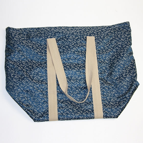 View of the tombo themed brocade bag empty.
