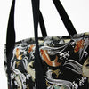 Close-up of the straps on the Koi themed brocade bag.