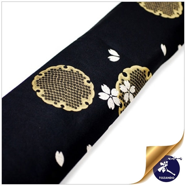 Close-up of the luxurious yukiwa and sakura silk brocade design.