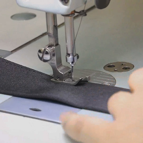 Close-up of our tailors at work.