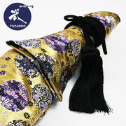The hanawa flower ring brocade with a black fusa himo.