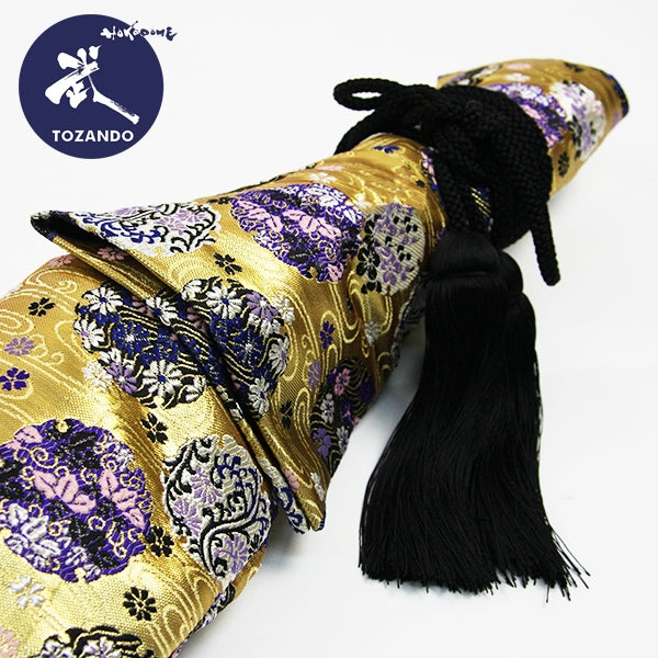 The hanawa flower ring brocade with a black fusa himo.
