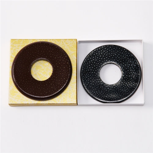 The brown (left) and black (right) same tsuba side by side.