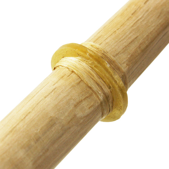 The leather tusba seen attached to a white oak naginata.