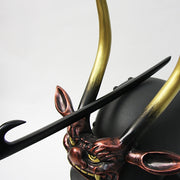 Kabutowari shown against a yoroi kabuto.