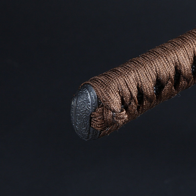 Close-up of the finely wrought karakusa kashira.