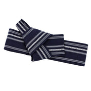 The navy obi fully tied.