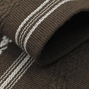 Close-up of the brown obi's hem.