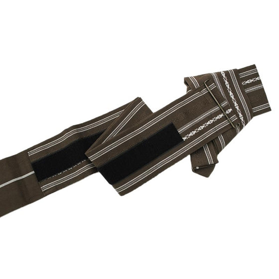 The brown obi unfolded.