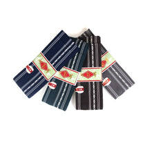  The four colour variations of silk kaku obi next to each other.