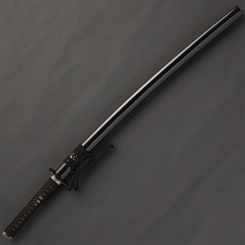 The iaito inside a kuroro gloss black saya