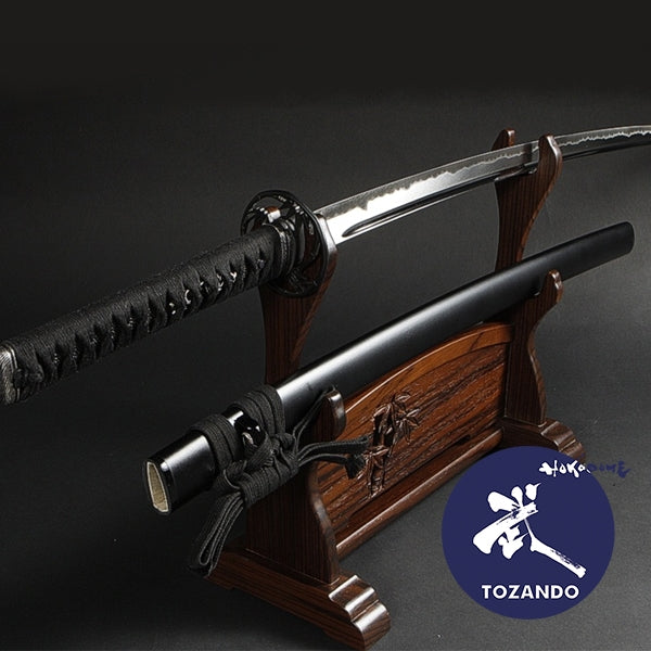 Tensho koshirae on a rack, outside of its saya.
