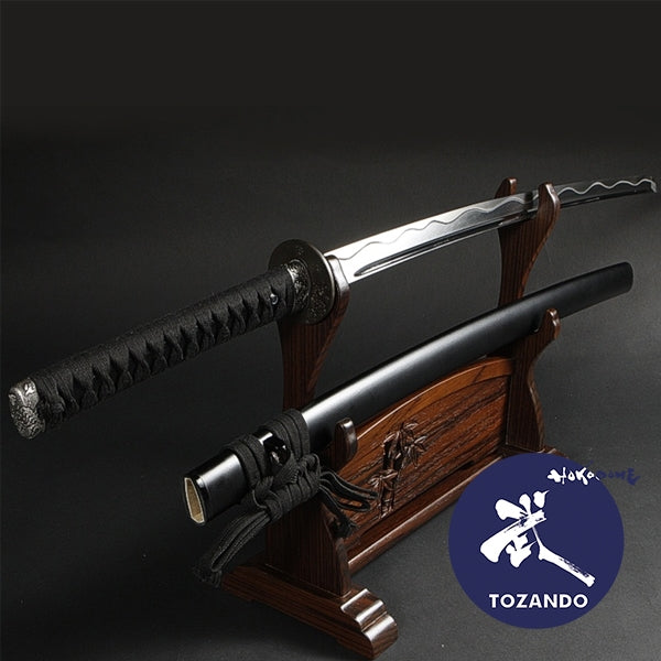 Full view of the iaito on a rack outside of the saya.
