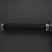 Full view of the tsuka fittings with a nami chidori theme.