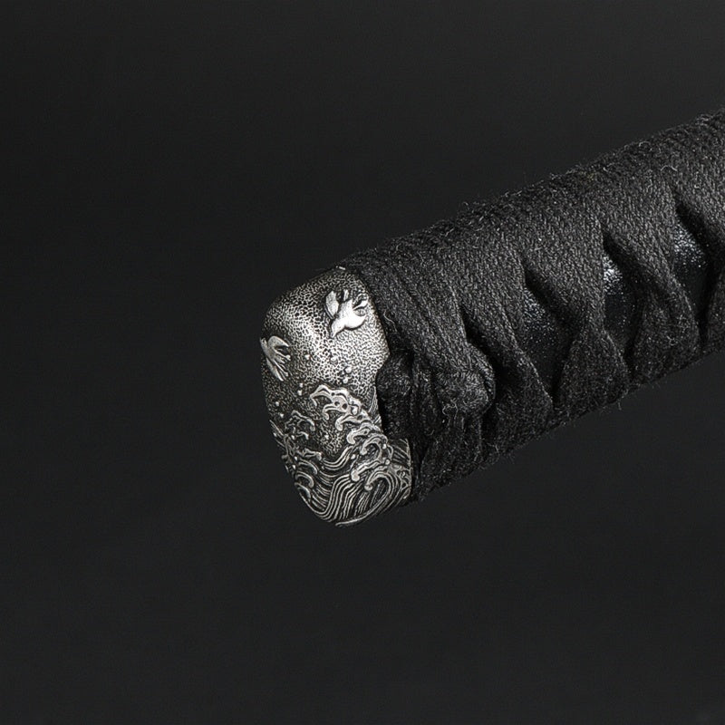 Close-up of the satsuma style nami chidori kashira fitting.
