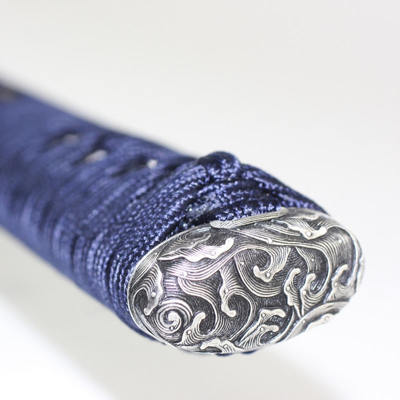 Tsuka kashira fittings seen close-up.