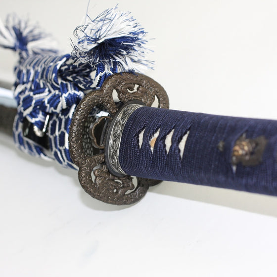View of the iaito in the saya from the tsuka side of the tsuba.