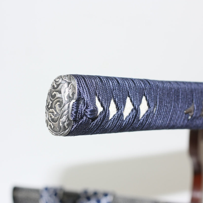 Close-up of the hiranami kashira and silk navy ito.