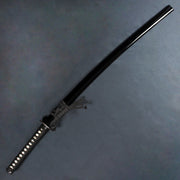 The tachi inside its saya.