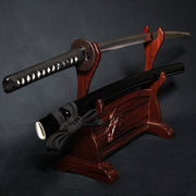 The tachi on a rack out of its saya.
