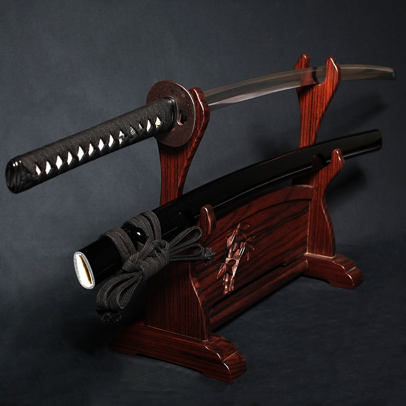The tachi on a rack out of its saya.