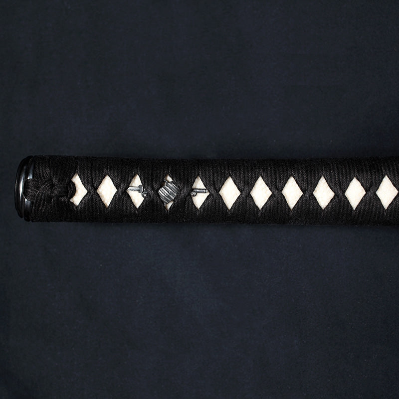 Close-up of the longer tachi tsuka with its menuki and hinerimaki wrapping.
