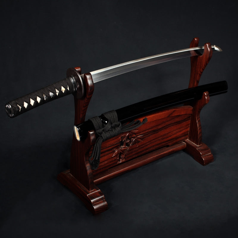 The kodachi unsheathed on a rack.