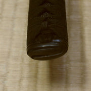 Close-up of the higo style black brass kashira fitting.