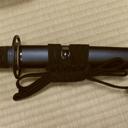 The iaito's kuroishime style saya with black sageo.