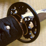 The sakura fuchi fitting and tsuba seen from the ura side.