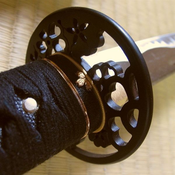 The sakura fuchi fitting and tsuba seen from the ura side.