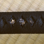 The sakura menuki wrapped beneath the hinerimaki and above black same.