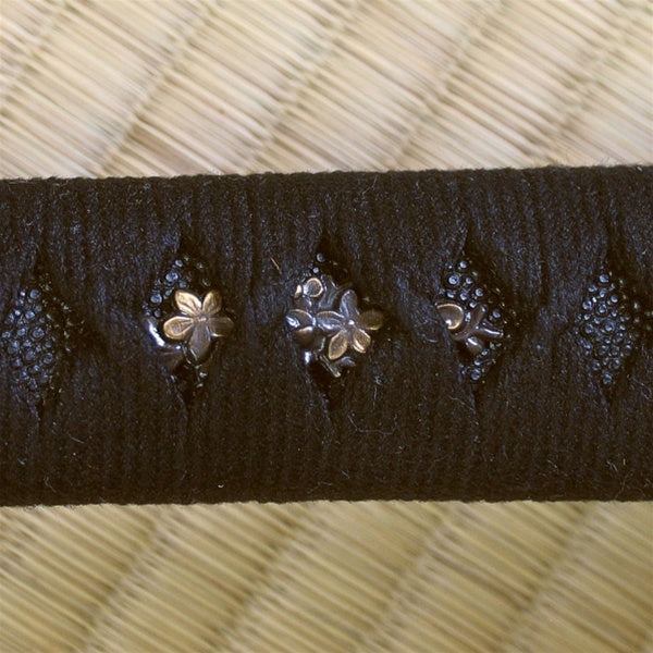The sakura menuki wrapped beneath the hinerimaki and above black same.