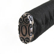 The silver-plated brass kashira fitting.