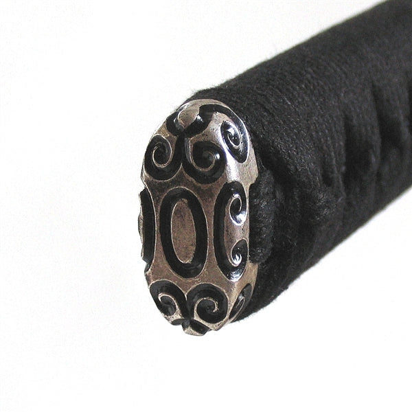 The silver-plated brass kashira fitting.