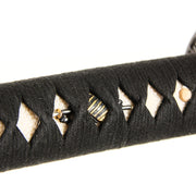 Close-up of the sode and naginata themed menuki.