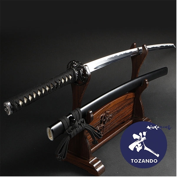 Full view of the soten iaito oon a rack and out of the saya.