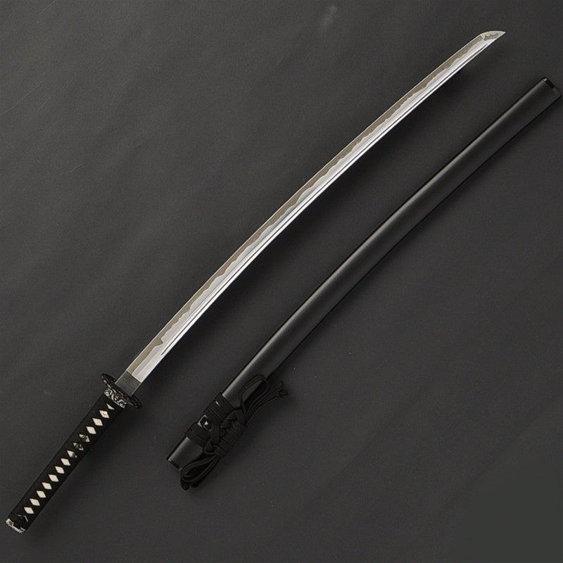 The iaito next to the saya.