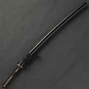 The iaito in its kuroro gloss black saya.