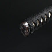 Close up of the kashira fittings on the tsuka.