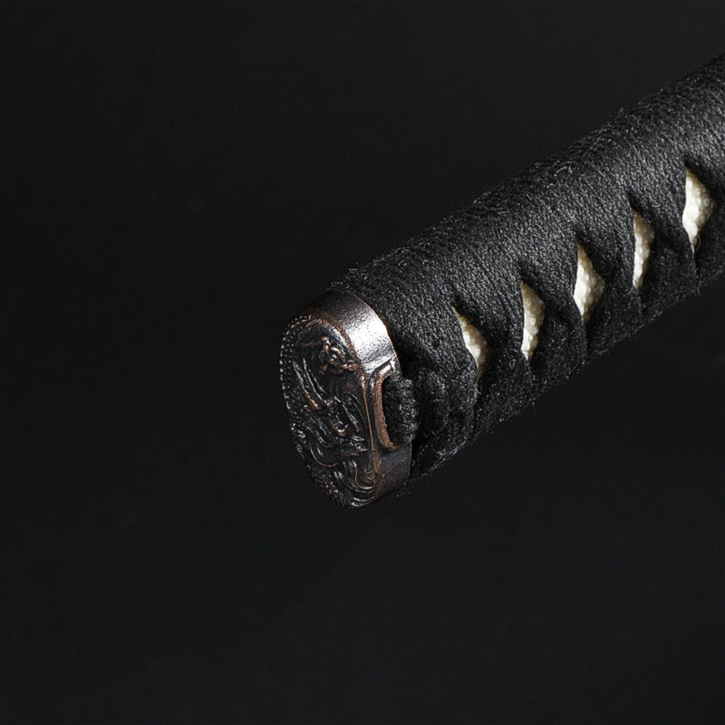 Close up of the kashira fittings on the tsuka.