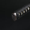 Close up of the kashira fittings on the tsuka.