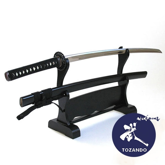 The Toryumon Zero koshirae on a rack outside of its saya.