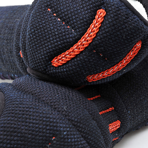 Close-up of the orizashi reinforcement and orange kazari ito with white yabane.