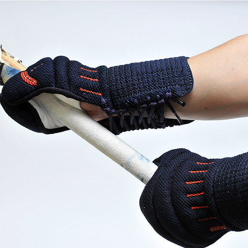 The kote worn holding a shinai.
