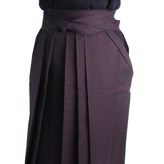 The #11000 hakama's front pleats and obi worn with dogi.