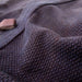 Fabric and sashiko-weave close-up.