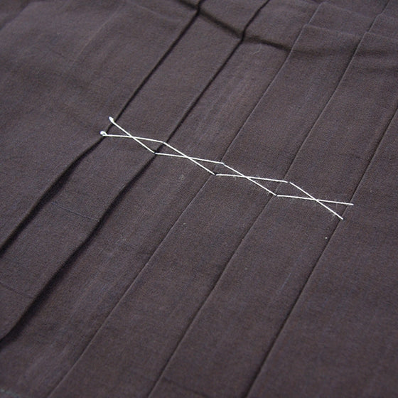 Front pleats close-up.
